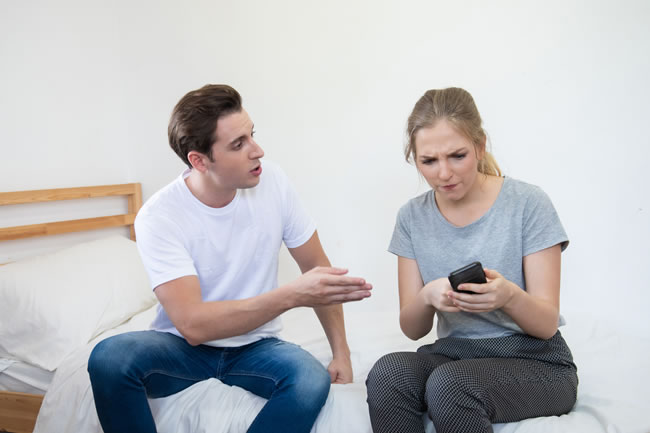 couple arguing over phone message